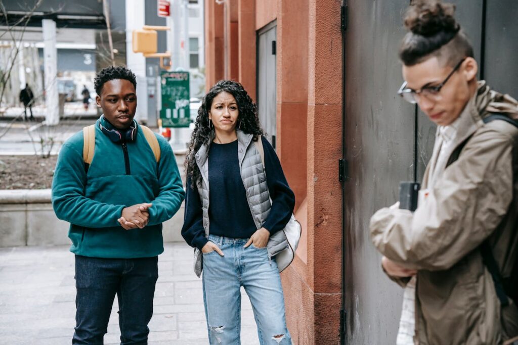 Two people bullying a person